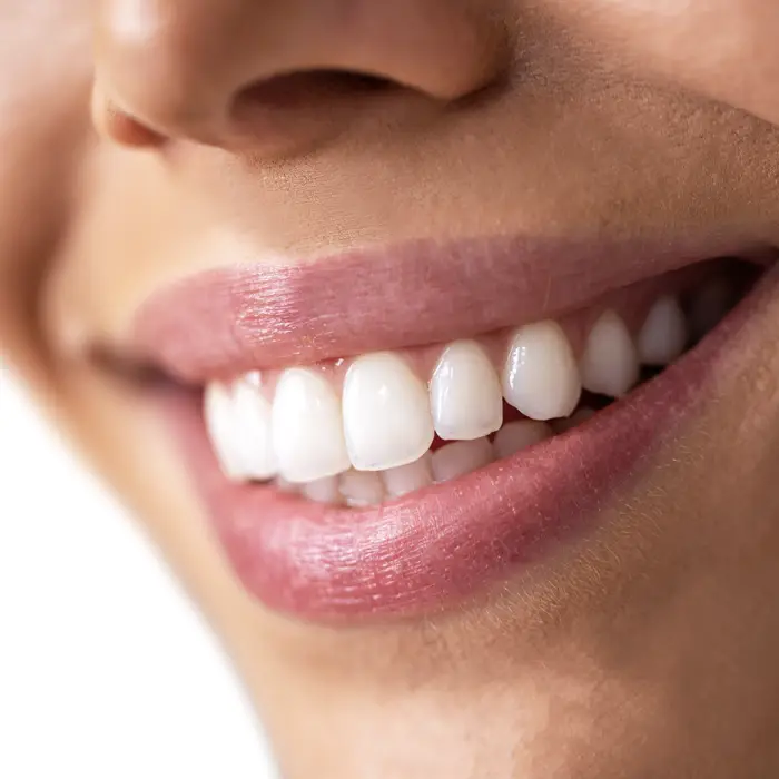 A woman smiling brightly